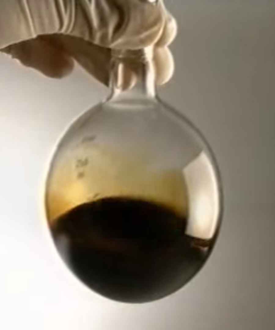 An example of crude oil in a glass container.