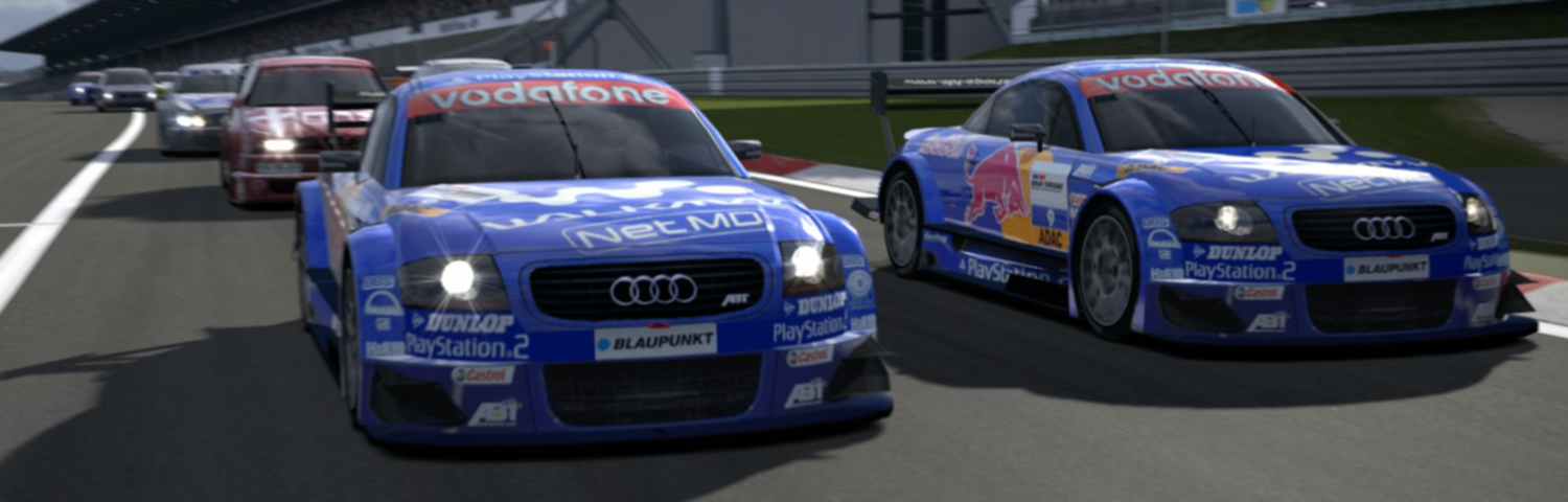 Two Audi TT-R Touring Cars with Red Bull colors.