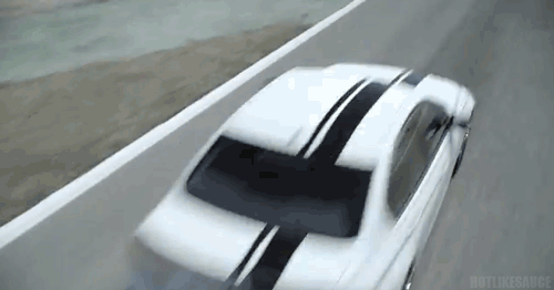 A white BMW M3 driving. (Animated GIF)