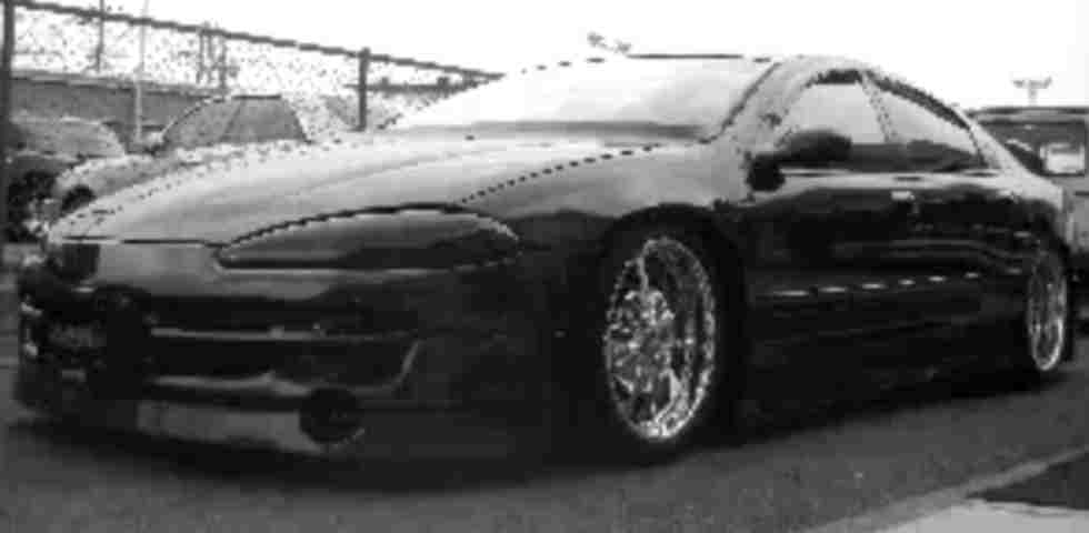 A custom black 2001 dodge intrepid.