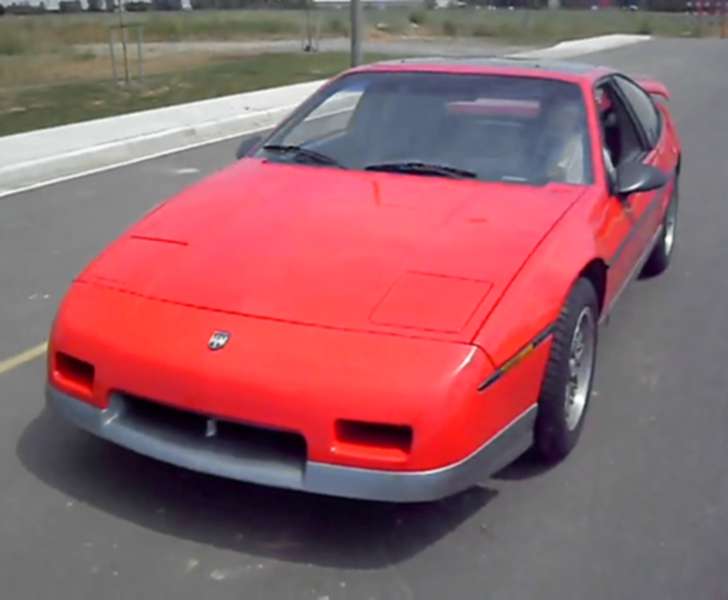 A Pontiac Fiero in red.